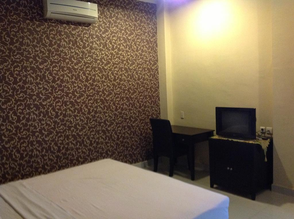 Carolina Transit Hotel Medan Room photo